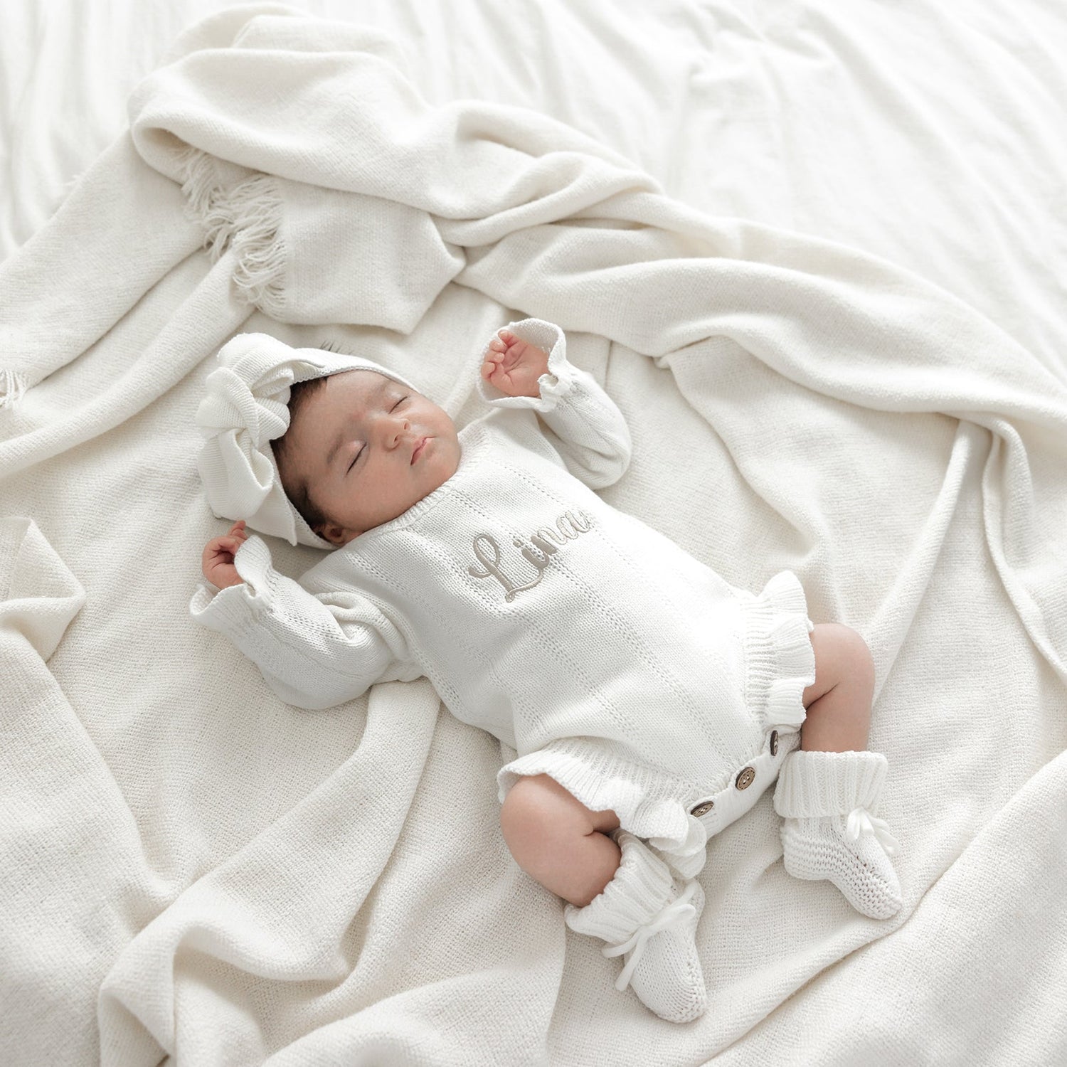 Gebreide rompers en accessoires